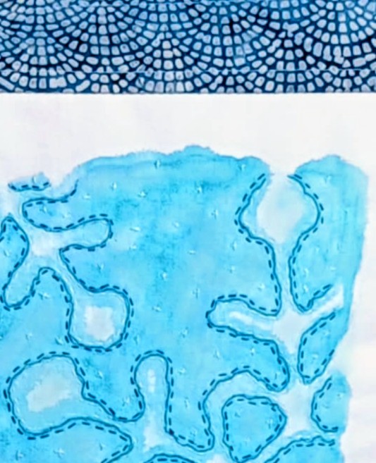 Nærbilde av håndmalt, håndbrodert og håndquiltet pute