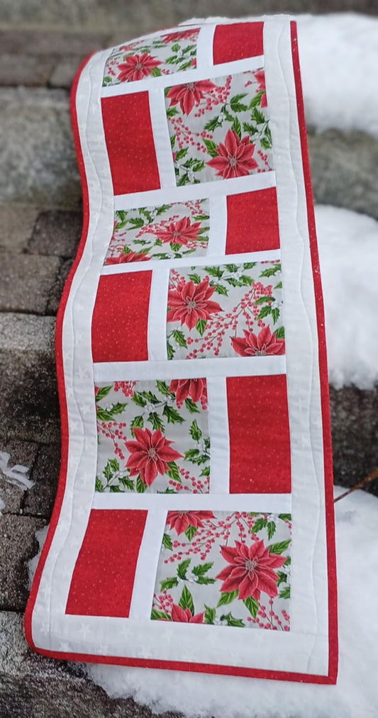 Quiltet løper med julestjernemotiv